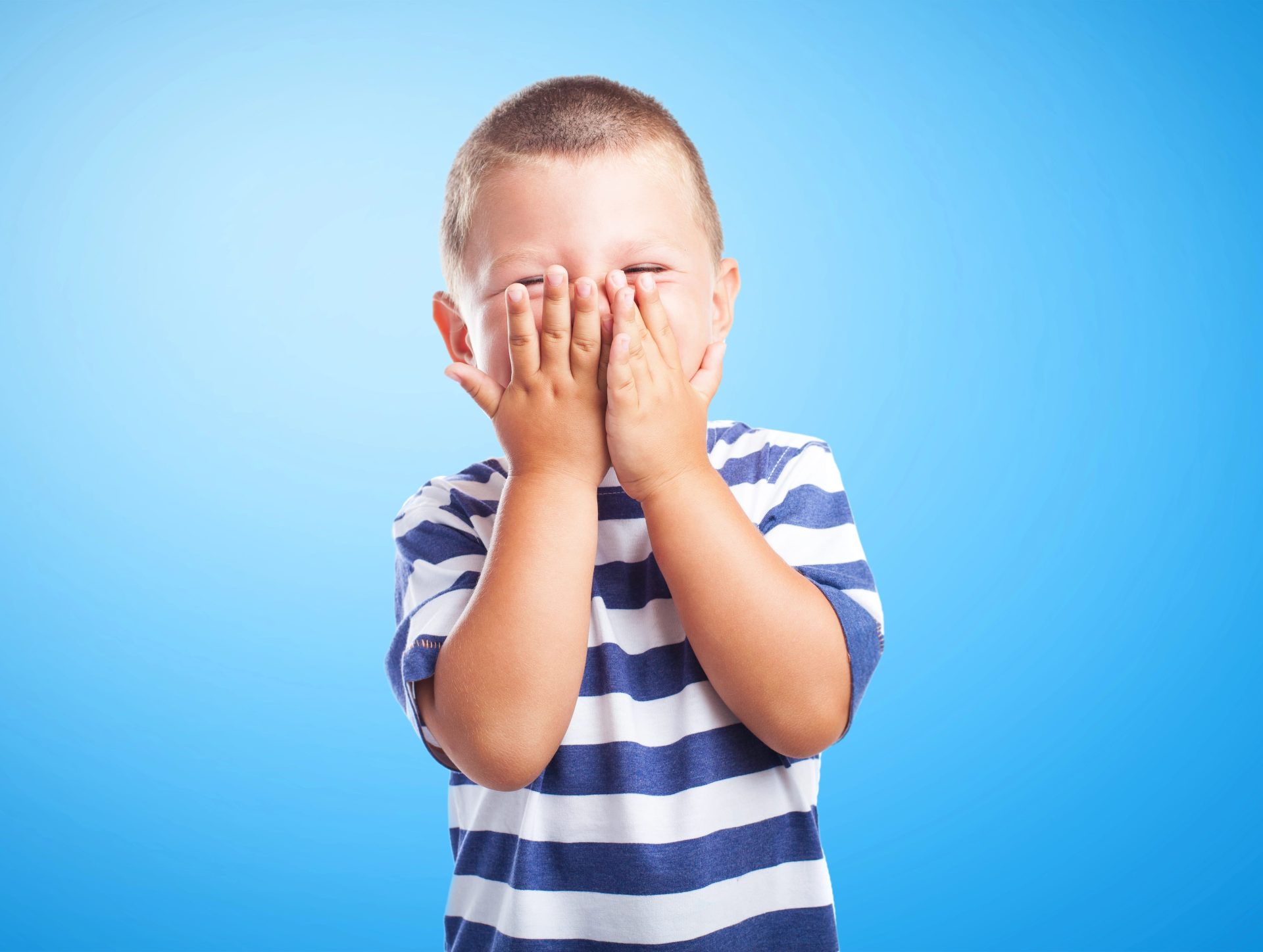 Depositphotos_62765315_XL-min Child playing with hands over their face