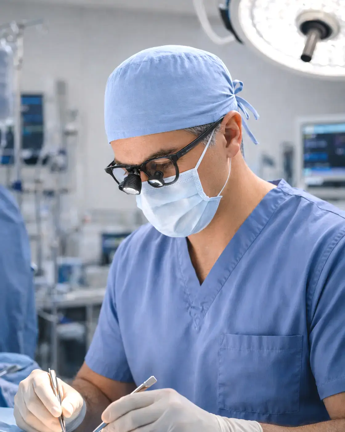Dr. John Amato performing surgery in the operating room