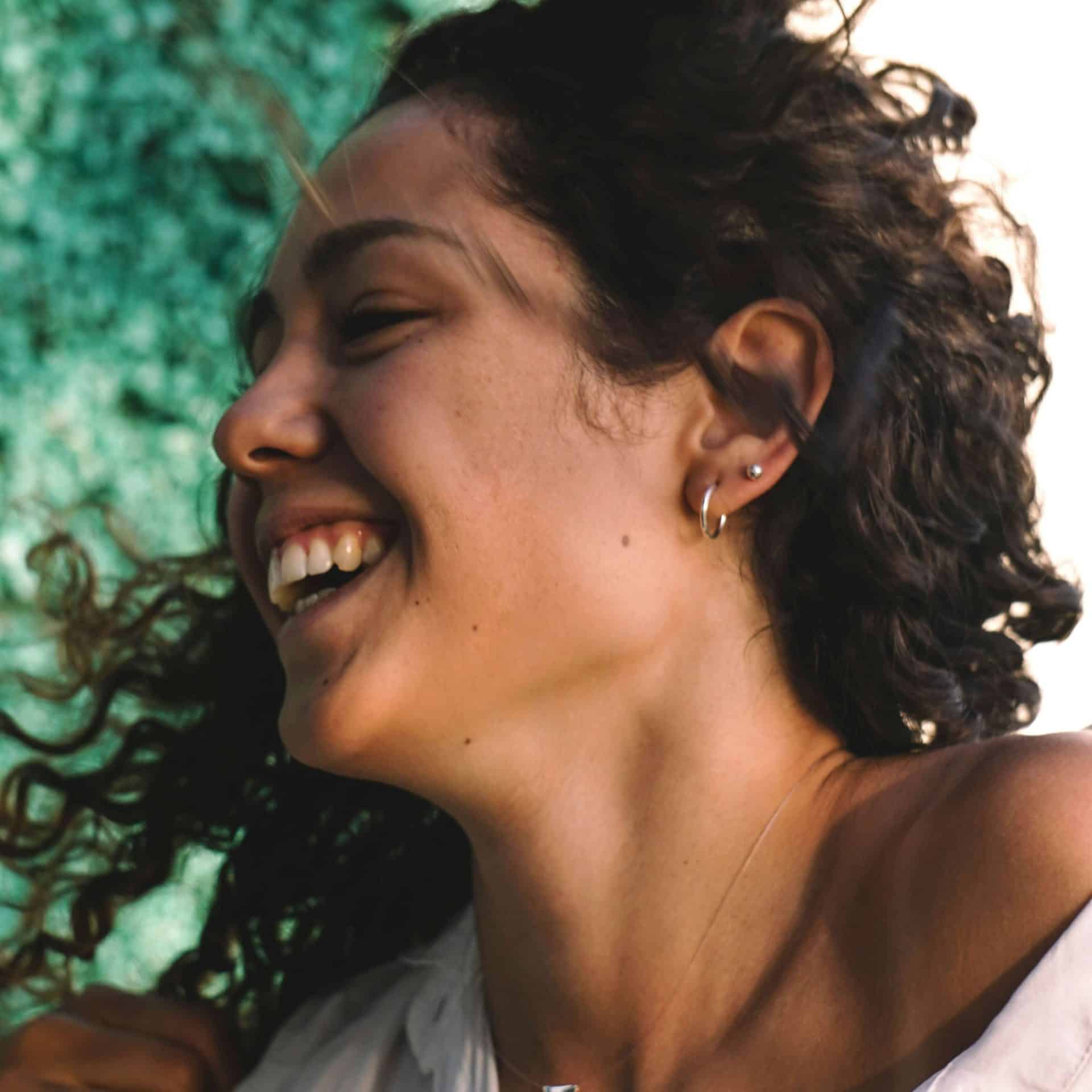 happy laughing girl showing jawline