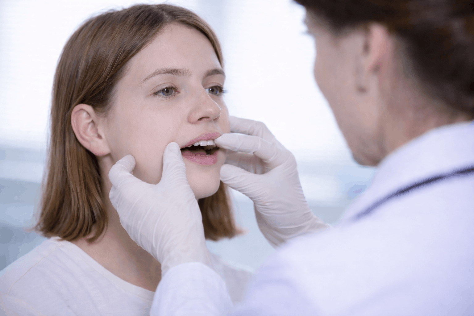 Clinical jaw evaluation with a patient.
