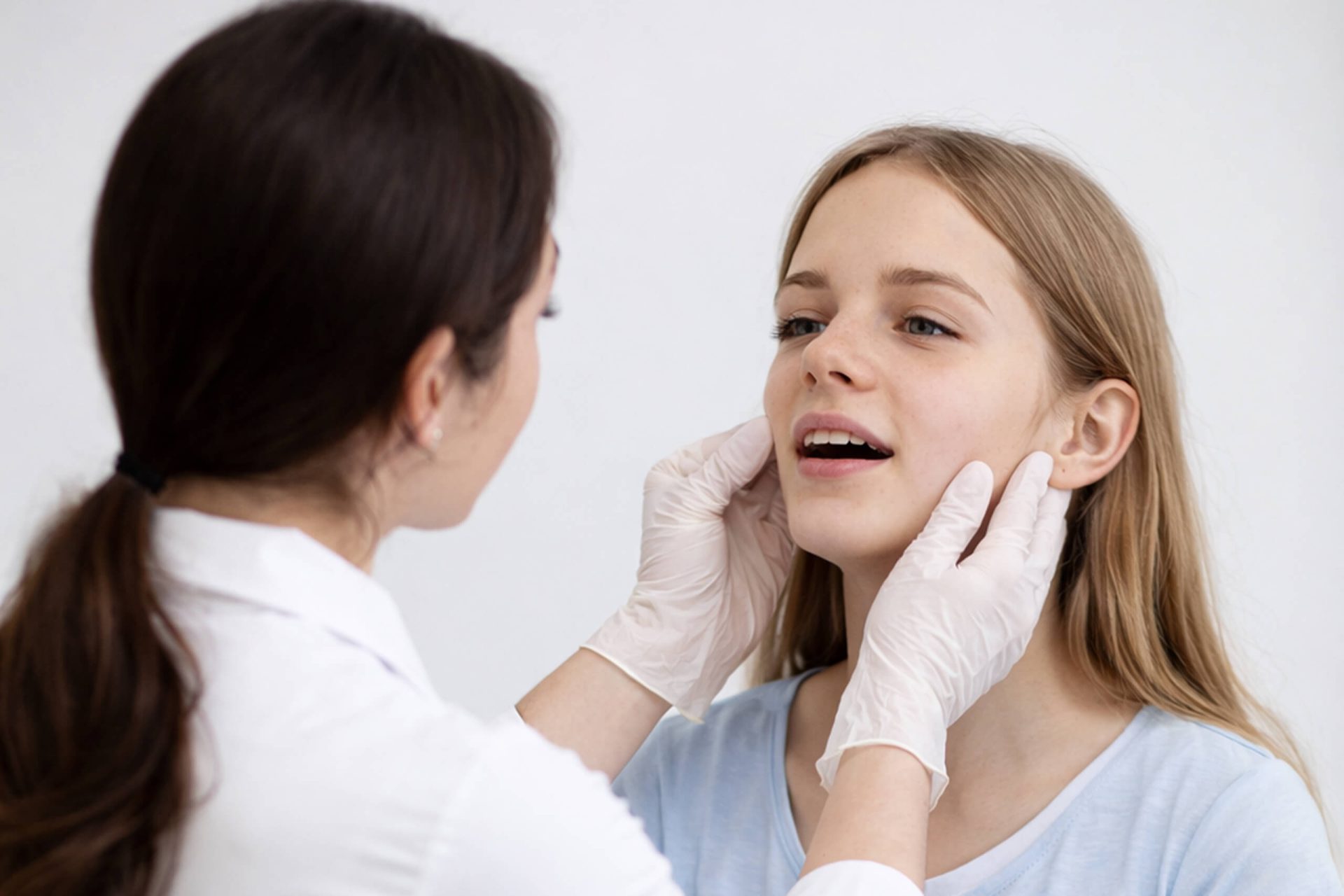 Clinical jaw evaluation with a patient.