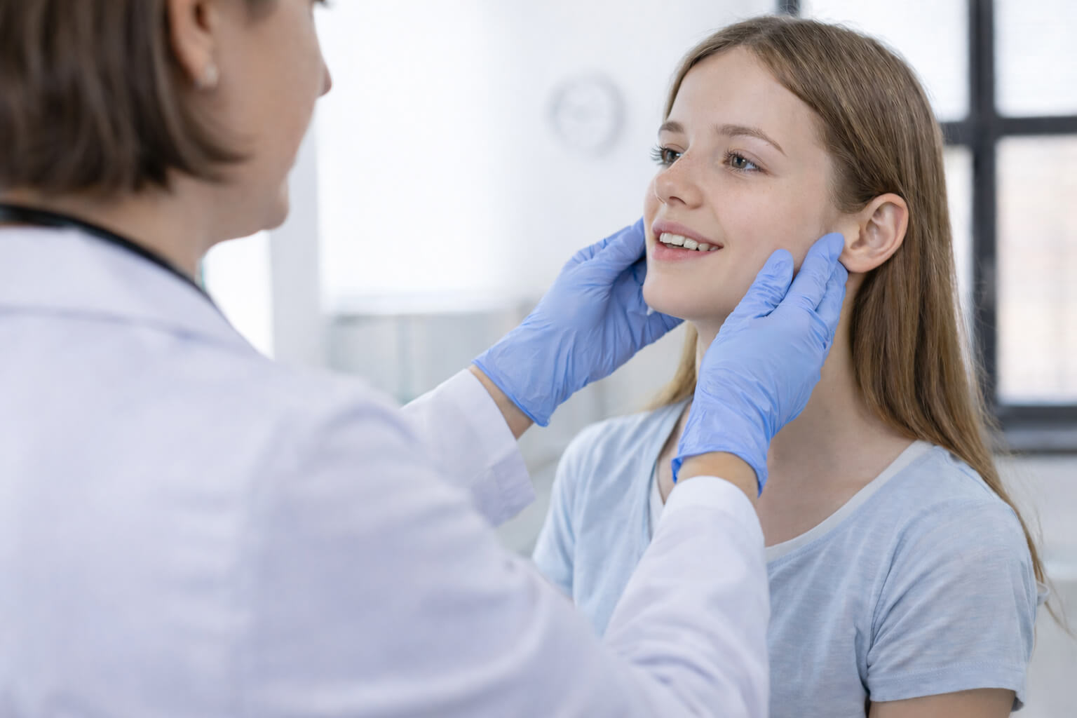 Clinical jaw evaluation with a patient.