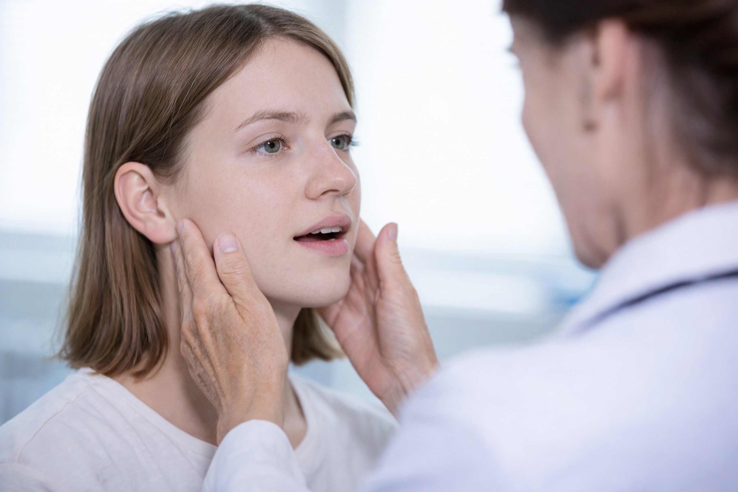 Clinical jaw evaluation with a patient.