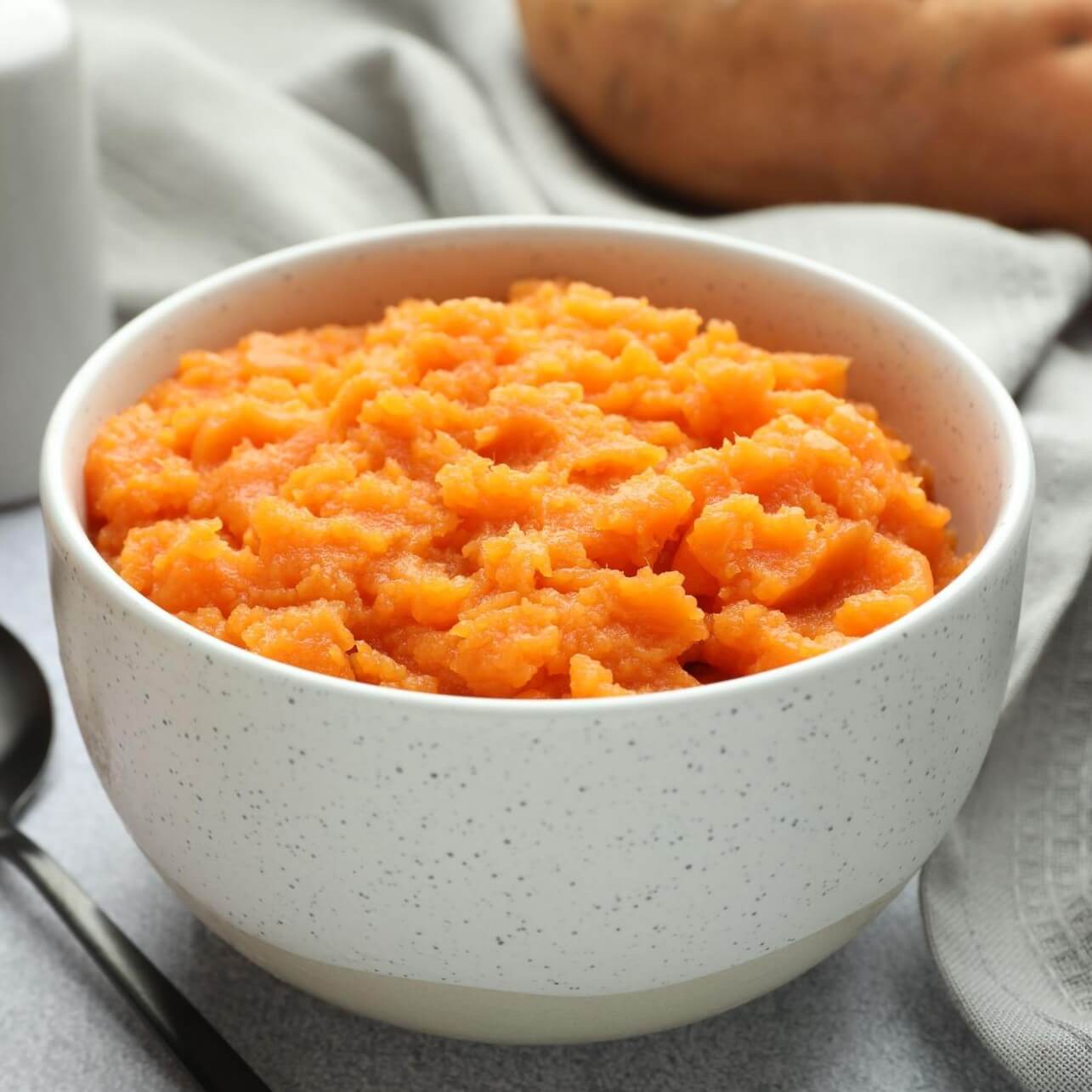 Bowl of creamy mashed sweet potatoes.