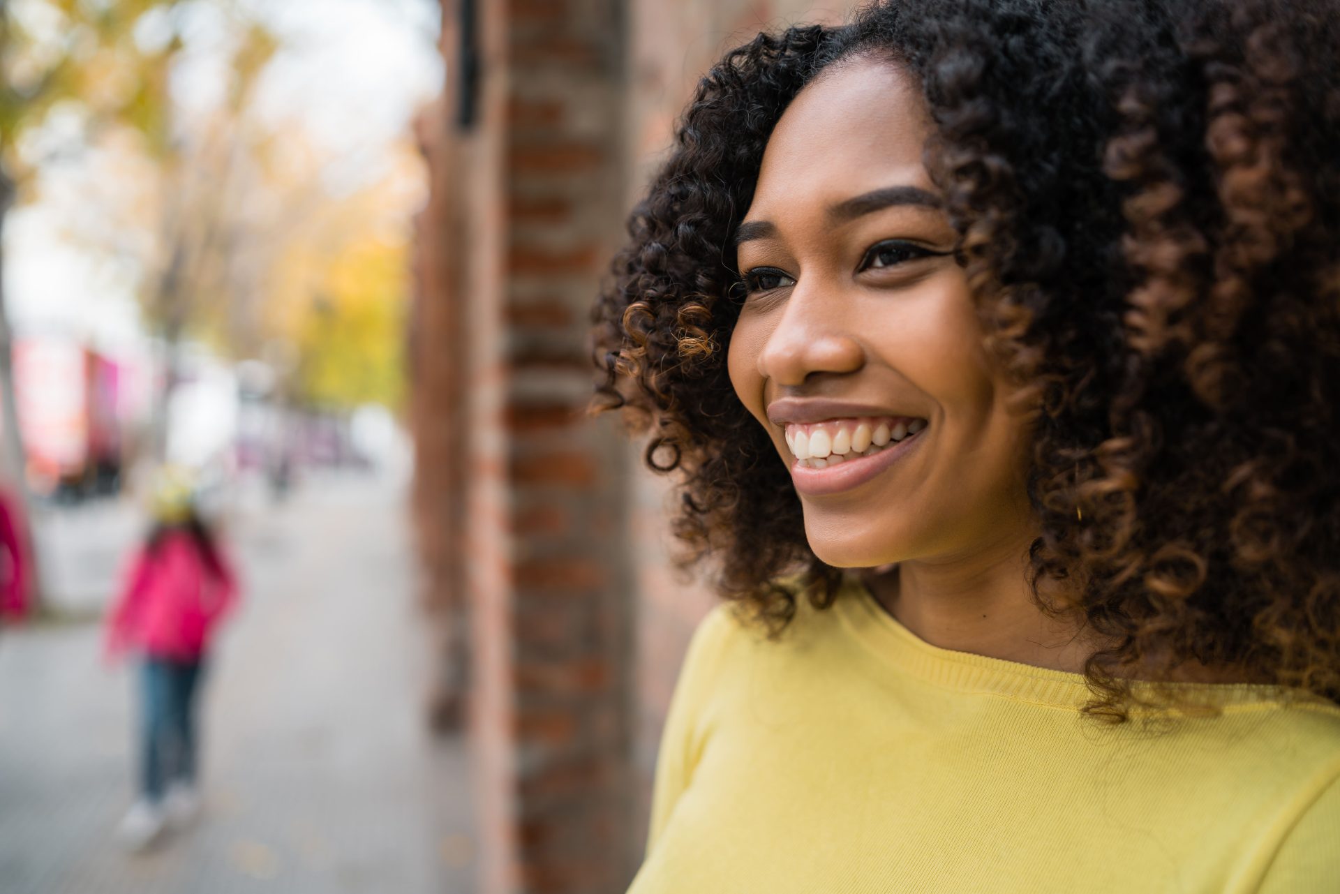portrait-woman-street Woman smiling outdoors on a street