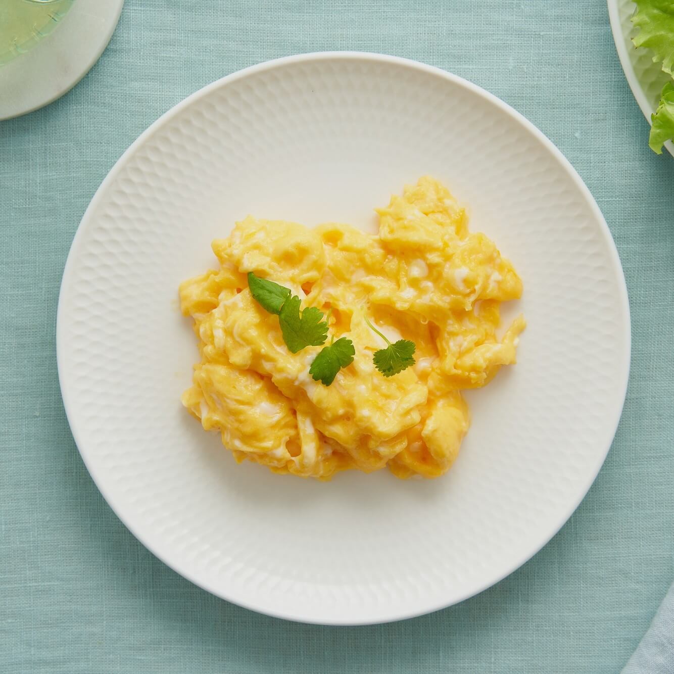 Bowl of soft scrambled eggs.