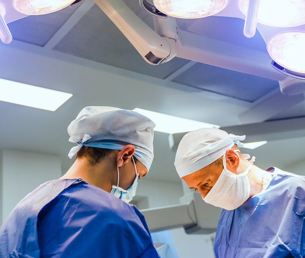 Two Doctors performing jaw surgery in the OR