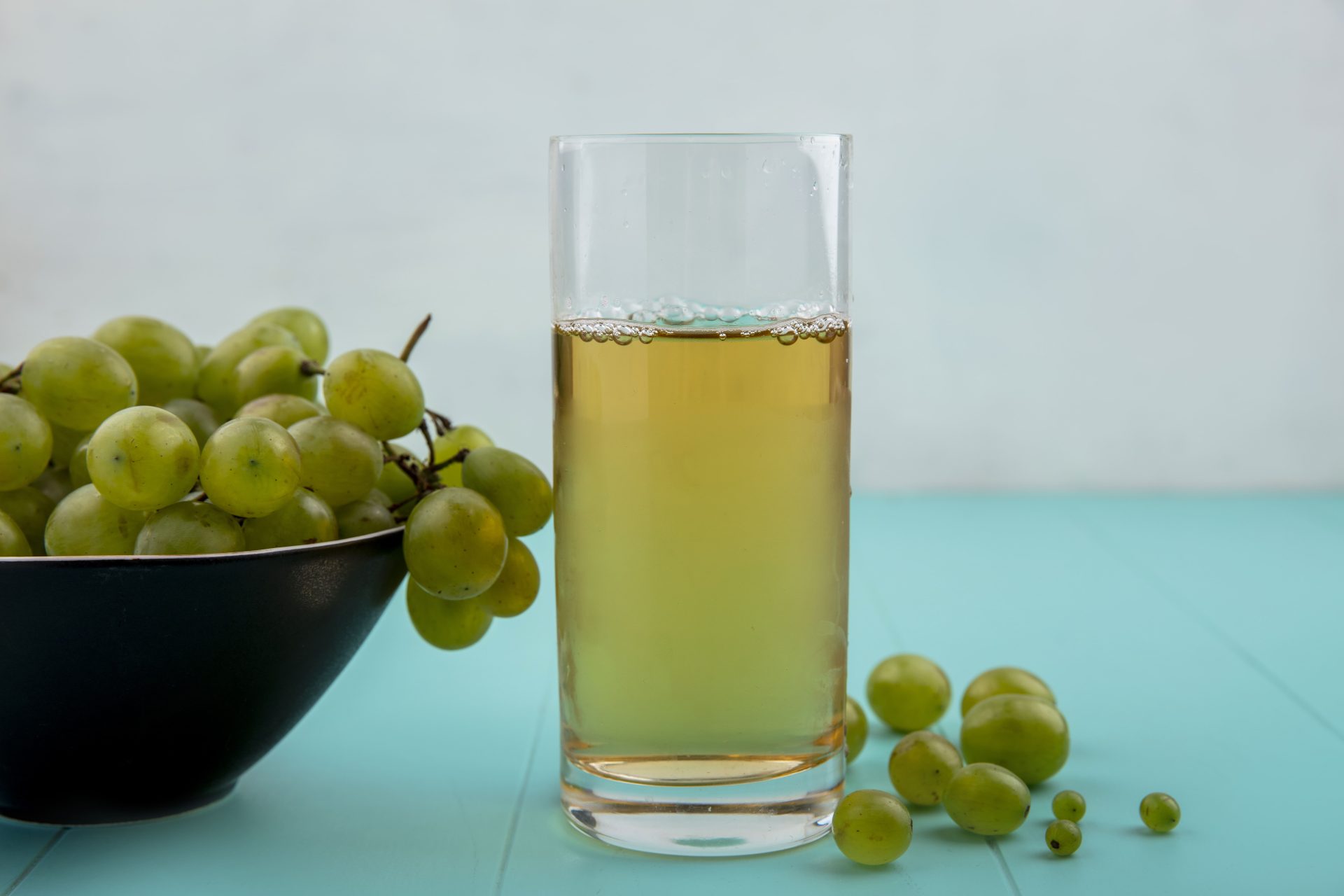 Glass of white grape juice.