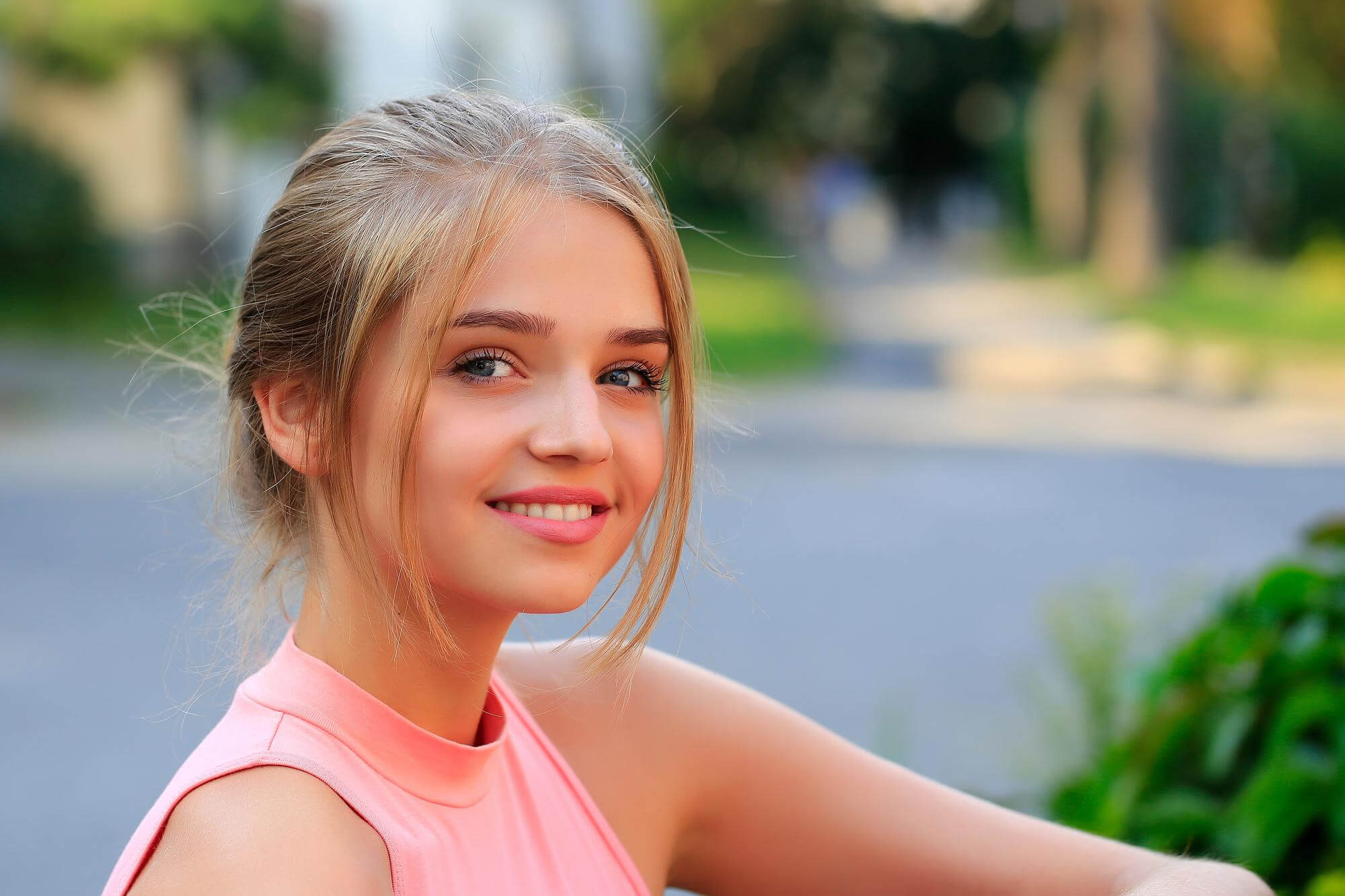young beautiful blond hair girl smiling.